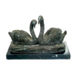 A bronze sculpture of two swans by J B Deposee.