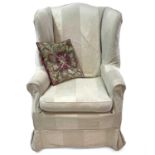 A Georgian style wing armchair.