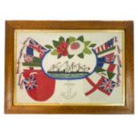 A 20th century sailor's woolwork picture decorated with flags, ships and anchor.