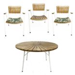 A Danish garden table and three chairs by Daneline