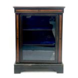 A Victorian ebonised walnut inlaid pier cabinet with brass mounts and boxwood stringing.