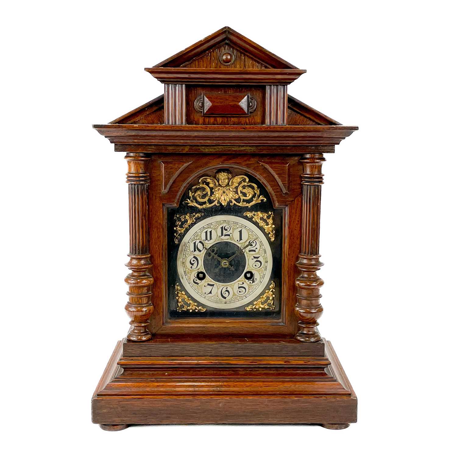 A German oak cased quarter striking mantel clock.