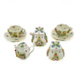 A 19th century Sitzendorf porcelain miniature tea set.