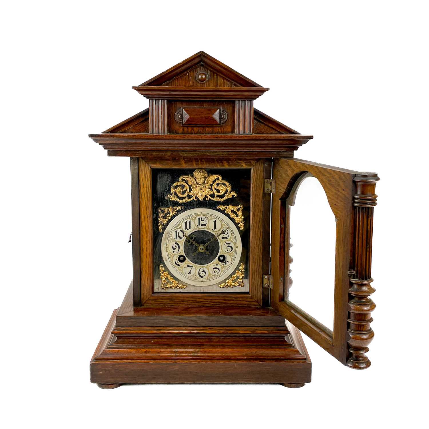 A German oak cased quarter striking mantel clock. - Image 11 of 12