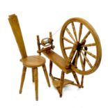 An oak spinning wheel and chair.