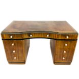 A Liberty & Co Art Deco ebonised and walnut pedestal desk.