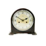 An Art Deco Enfield Bakelite dome top mantel clock.