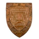 A Newlyn copper trophy shield for the Devon Music Competition.