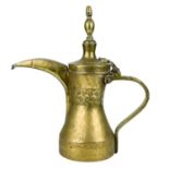 A large Saudi Arabian brass dallah pot, 19th century.