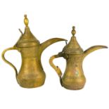 Two Saudi Arabian brass dallah pots, 19th century.