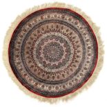 A circular silk rug.