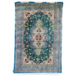 A fine Persian silk rug.