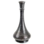 A 19th century Persian white metal damascened bottle vase.