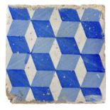 A Spanish blue and white pottery tile, 19th century.