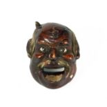 A small Japanese lacquered wood Noh mask, 19th century.