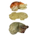 Three Chinese caved jade animal figures.