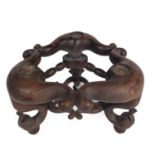 An unusual Chinese carved hardwood stand, 19th century.