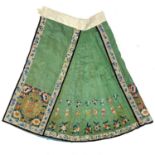 A Chinese green silk embroidered skirt, late 19th century.