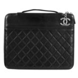 A Chanel black lambskin quilted leather mini ipad case.