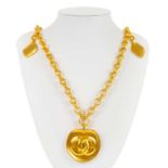 A Chanel gold tone medallion pendant necklace.