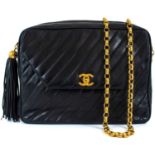 A Chanel black lambskin leather chevron camera bag.