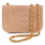 A Chanel beige lizard mini flap CC shoulder bag.