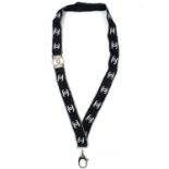 A Chanel white tone metal and crystal set CC lanyard.