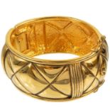 A Chanel 1980's gold-tone quilted design hinged bangle.