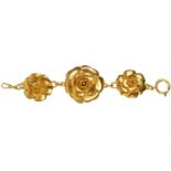 A Chanel 1980's gold tone triple flower head bracelet.