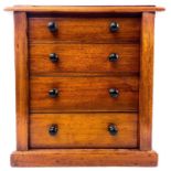 A Victorian mahogany four drawer Wellington type collector's chest.