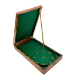 A late Victorian mahogany tabletop folding bagatelle game.