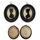 A pair of Victorian silhouette portraits.