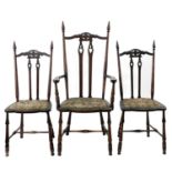 A set of three mahogany Arts and Crafts chairs.