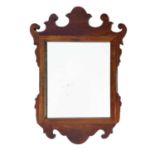 A George III style mahogany small fret work wall mirror.