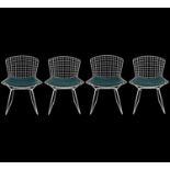 Four Harry Bertoia chairs by Knoll.