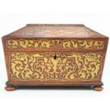 A Regency rosewood and brass inlaid work box.