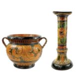 A Majolica twin handled jardinere and stand.