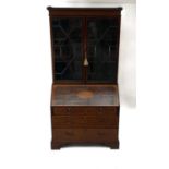 A George III mahogany and satin wood crossbanded bureau bookcase.