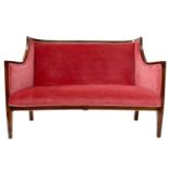 An Edwardian mahogany framed two seater settee.