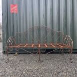 A wrought iron daybed.