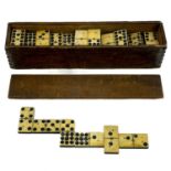 A set of 19th century bone and ebony dominos.
