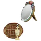 A circular Barbola style easel mirror.