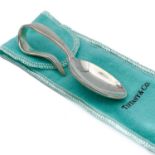 A Tiffany & Co sterling silver baby feeding spoon.