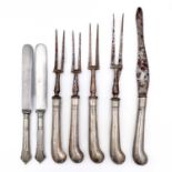 A Victorian silver filled pistol handled set of four meat forks and carving knife.