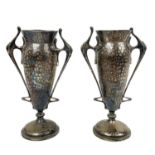 A pair of Edwardian Arts and Crafts twin handled pedestal vases by H Greaves Ltd.