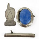 An Edwardian silver novelty bookmark, a cigar pricker and a silver and enamel compact.