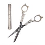 A pair of 19th century Dutch silver sewing scissors and a silver needle case.