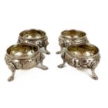 A Victorian silver set of four circular salts by Henry Holland.