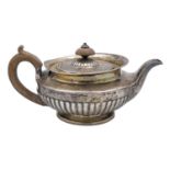 A George IV silver half fluted pedestal teapot by Thomas Burwash.