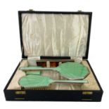 An George VI Art Deco silver green guilloche enamel cased four piece dressing table set.